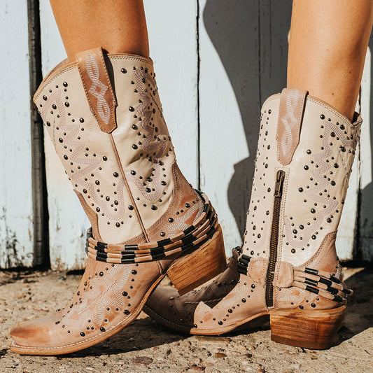 FREEBIRD women's Wisteria blush boot with western stitching, silver stud detailing, and decorative ankle belting