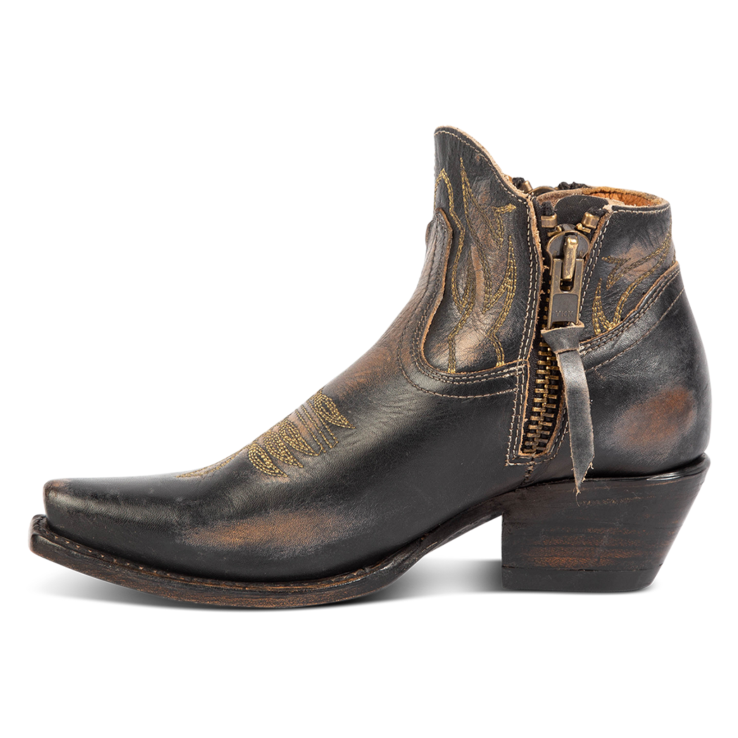 Side view of FREEBIRD women's Wolfie black leather bootie with stitch detailing and snip toe construction