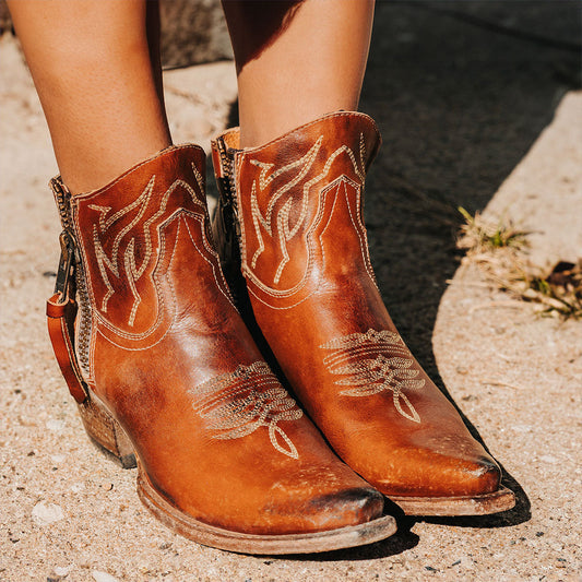 FREEBIRD women's Wolfie whiskey leather bootie with stitch detailing and snip toe construction