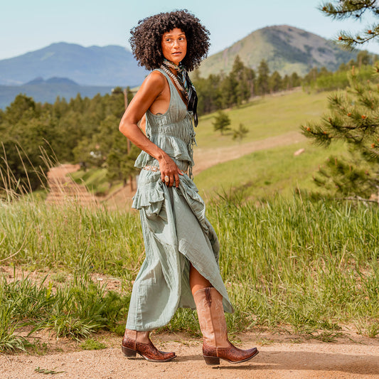 FREEBIRD women's WOODLAND clay-multi tooled leather western boots featuring a snip toe, decorative stitching, and traditional pull straps lifestyle