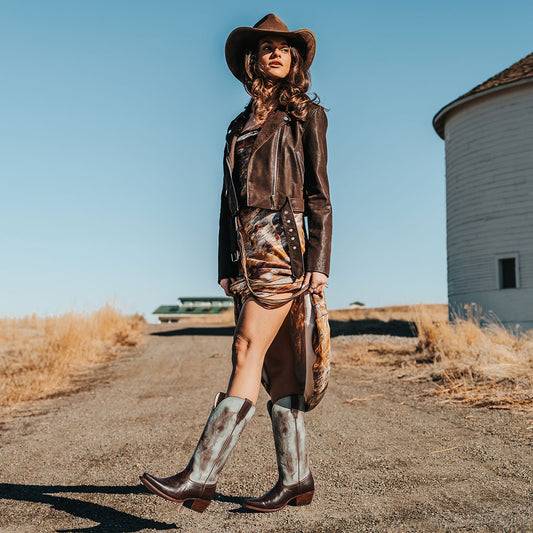 FREEBIRD women's WOODLAND patina multi leather western boots featuring a snip toe, decorative stitching, and traditional pull straps lifestyle