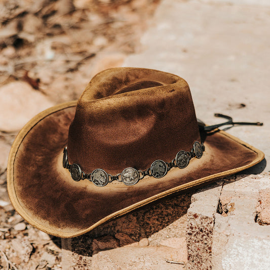 FREEBIRD Wyatt brown distressed faux suede hat with a pinched crown, curved brim and engraved coin belt