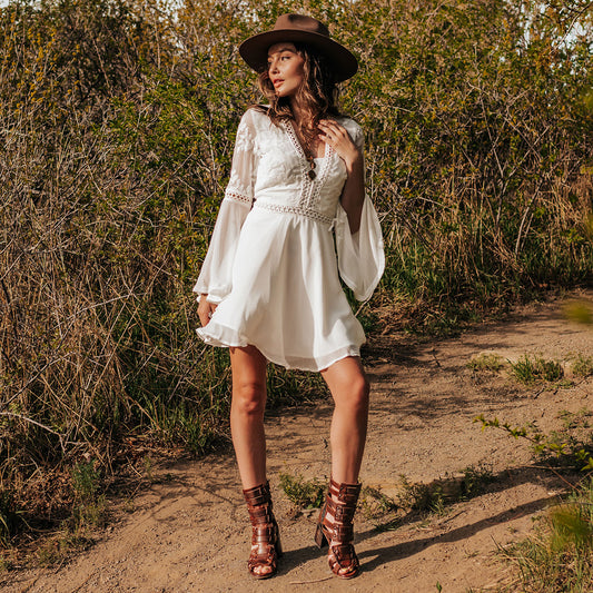 FREEBIRD women's Zeus Cognac Multi a strappy heeled sandal featuring adjustable buckles, leather, and stud detailing lifestyle image