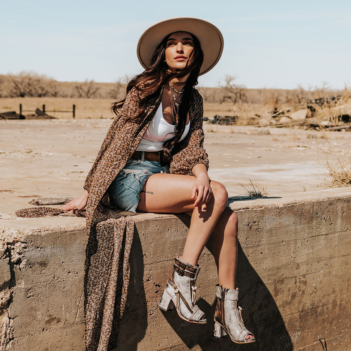 FREEBIRD women's Zombi ice sandal with zip and buckle leather detailing and stacked heel lifestyle image