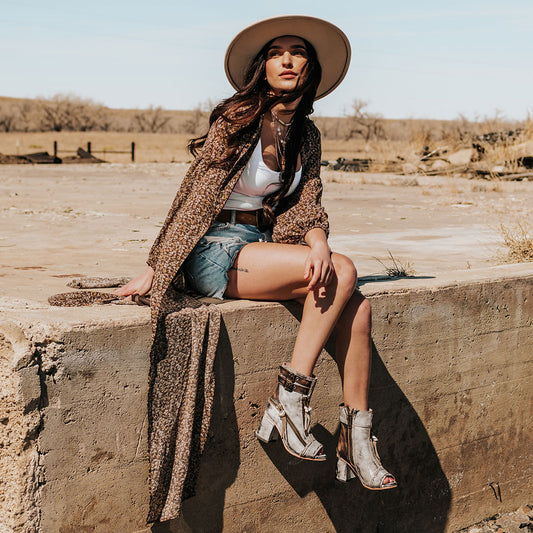 FREEBIRD women's Zombi ice sandal with zip and buckle leather detailing and stacked heel lifestyle image