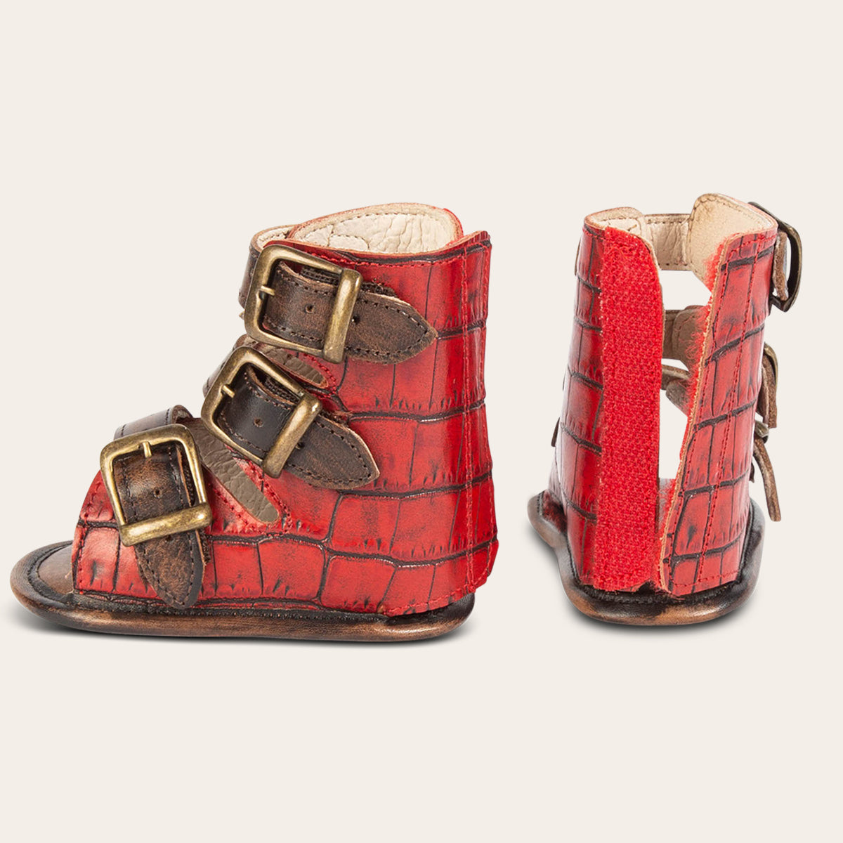 side and back view showing buckle fashion straps and back leather velcro panel on FREEBIRD infant baby bond red croco sandal
