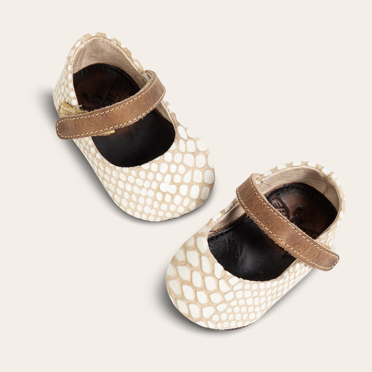 front view showing top leather strap on FREEBIRD infant baby Jane white snake leather shoe