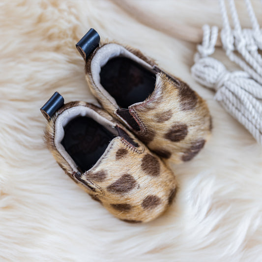 FREEBIRD infant baby kicks leopard leather shoe with pull tab and side elastic panel lifestyle image