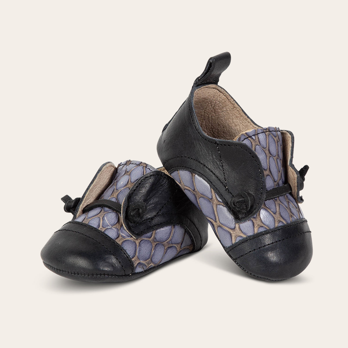 front view showing contrasting decorative knotted leather lace on FREEBIRD infant baby Mabel navy multi leather shoe