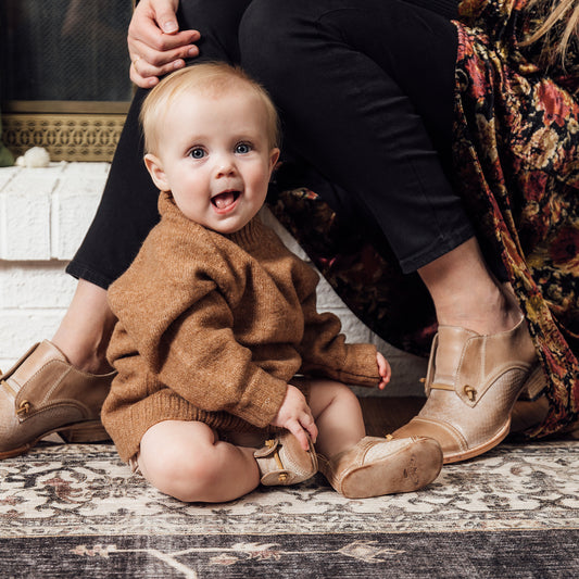 FREEBIRD infant baby Mabel taupe leather shoe with decorative knotted leather lace and hidden inside elastic panel lifestyle image