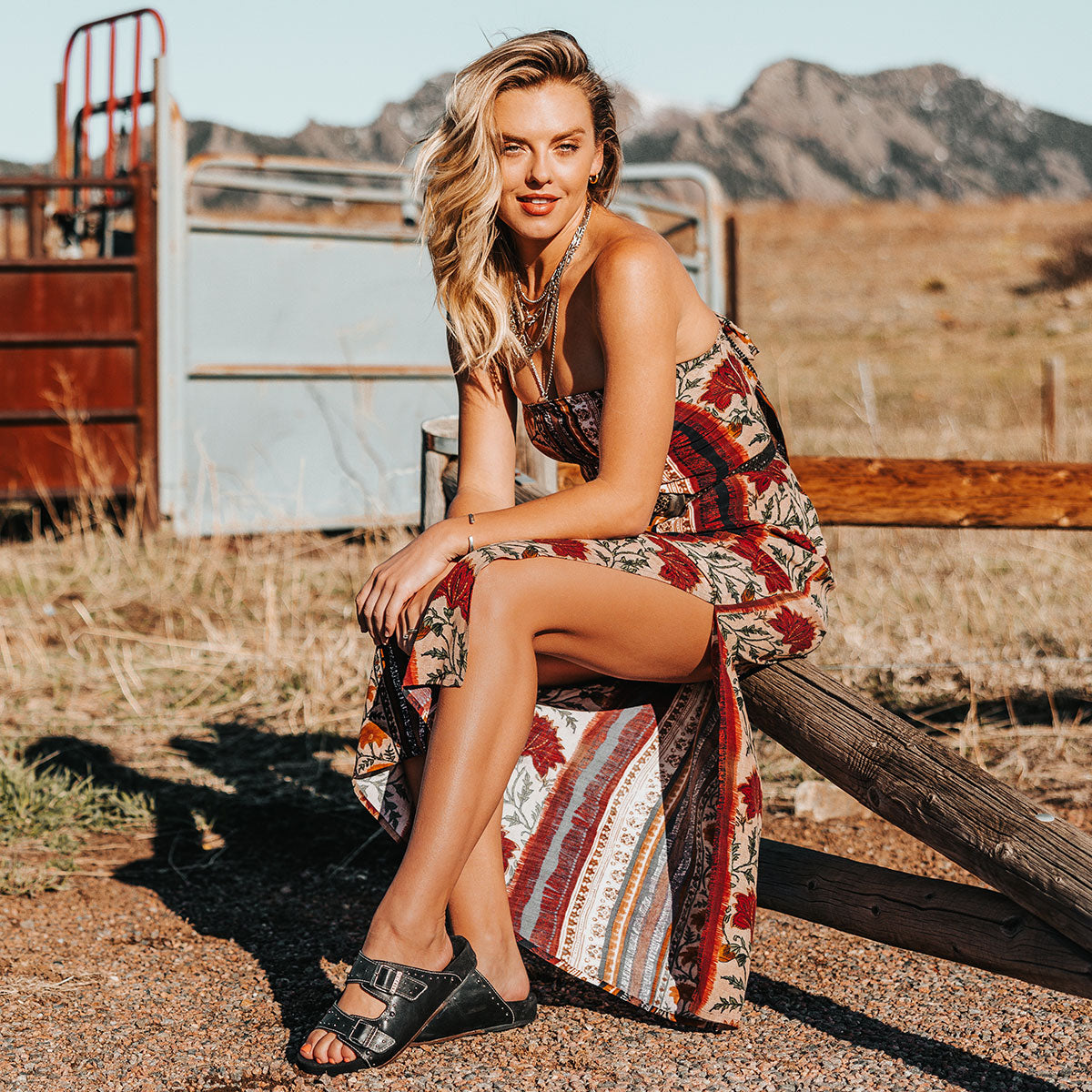 FREEBIRD women's Asher black sandal with adjustable belt buckles, a suede footbed and silver embellishments lifestyle image