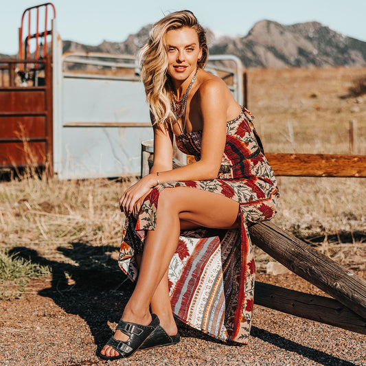 FREEBIRD women's Asher black sandal with adjustable belt buckles, a suede footbed and silver embellishments lifestyle image