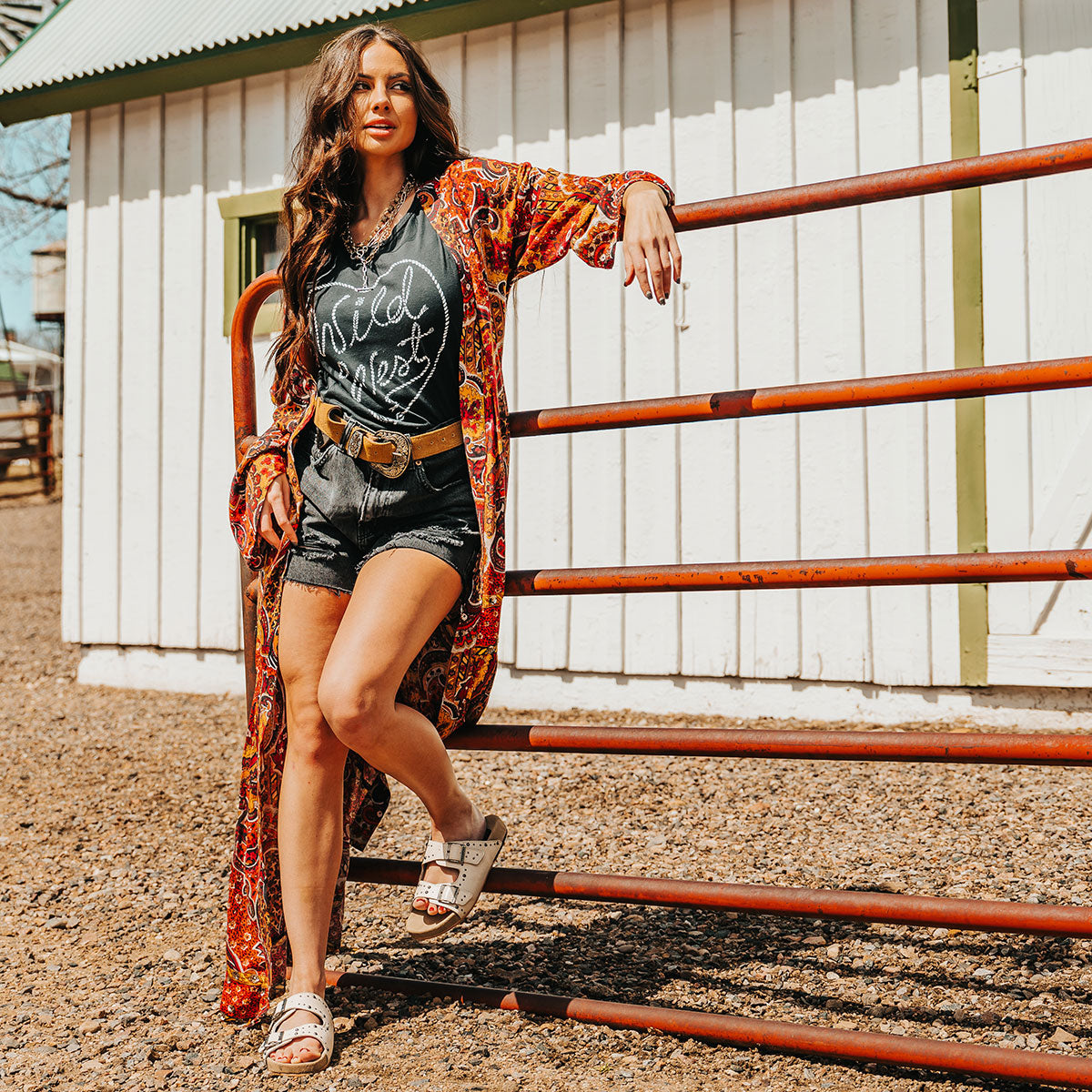 FREEBIRD women's Asher bone sandal with adjustable belt buckles, a suede footbed and silver embellishments lifestyle image