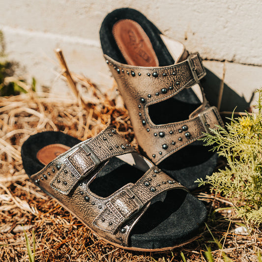 FREEBIRD women's Asher pewter sandal with adjustable belt buckles, a suede footbed and silver embellishments