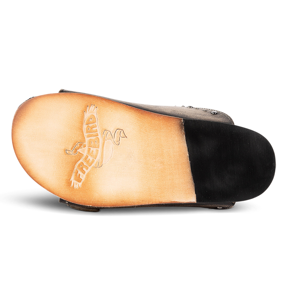 Leather sole with a tread heel imprinted with FREEBIRD on women's Asher pewter sandal 