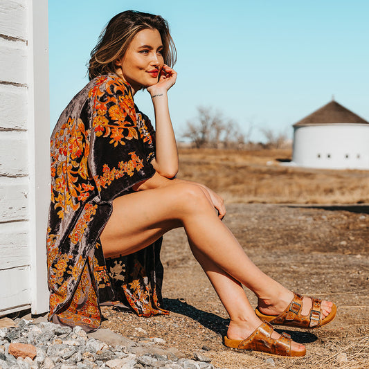 FREEBIRD women's Asher wheat leather sandal with adjustable belt buckles, a suede footbed and silver embellishments lifestyle image