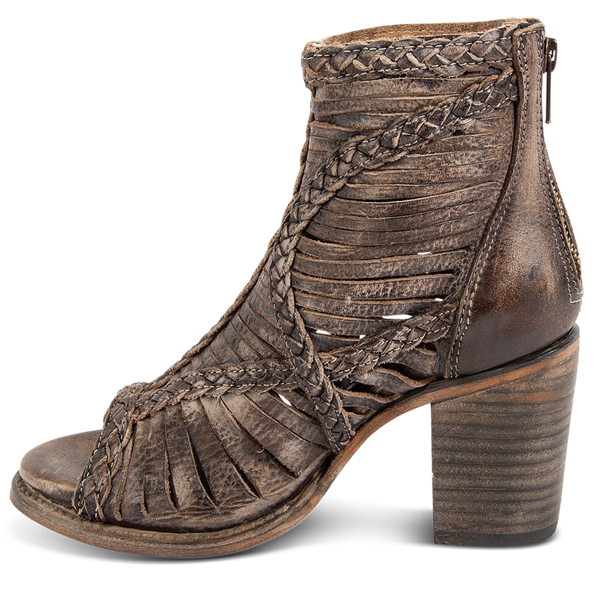 Inside view showing laser cut leather, detailed braided accents and a stacked heel on FREEBIRD women's Bela black distressed leather sandal