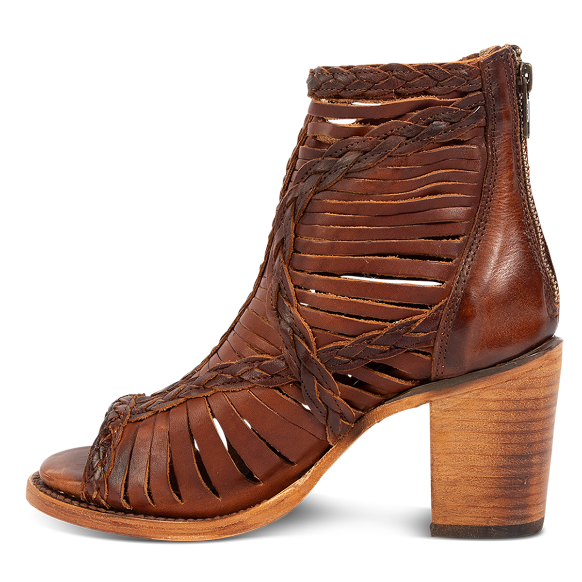 Inside view showing laser cut leather, detailed braided accents and a stacked heel on FREEBIRD women's Bela cognac leather sandal