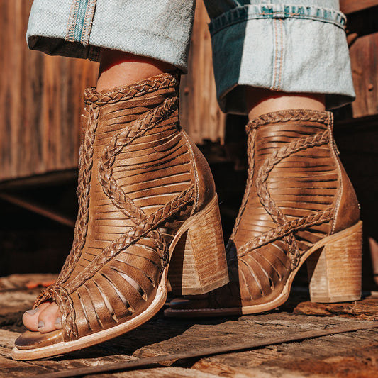 FREEBIRD women's Bela wheat leather sandal with laser cut leather, braided accents and a working brass zip closure