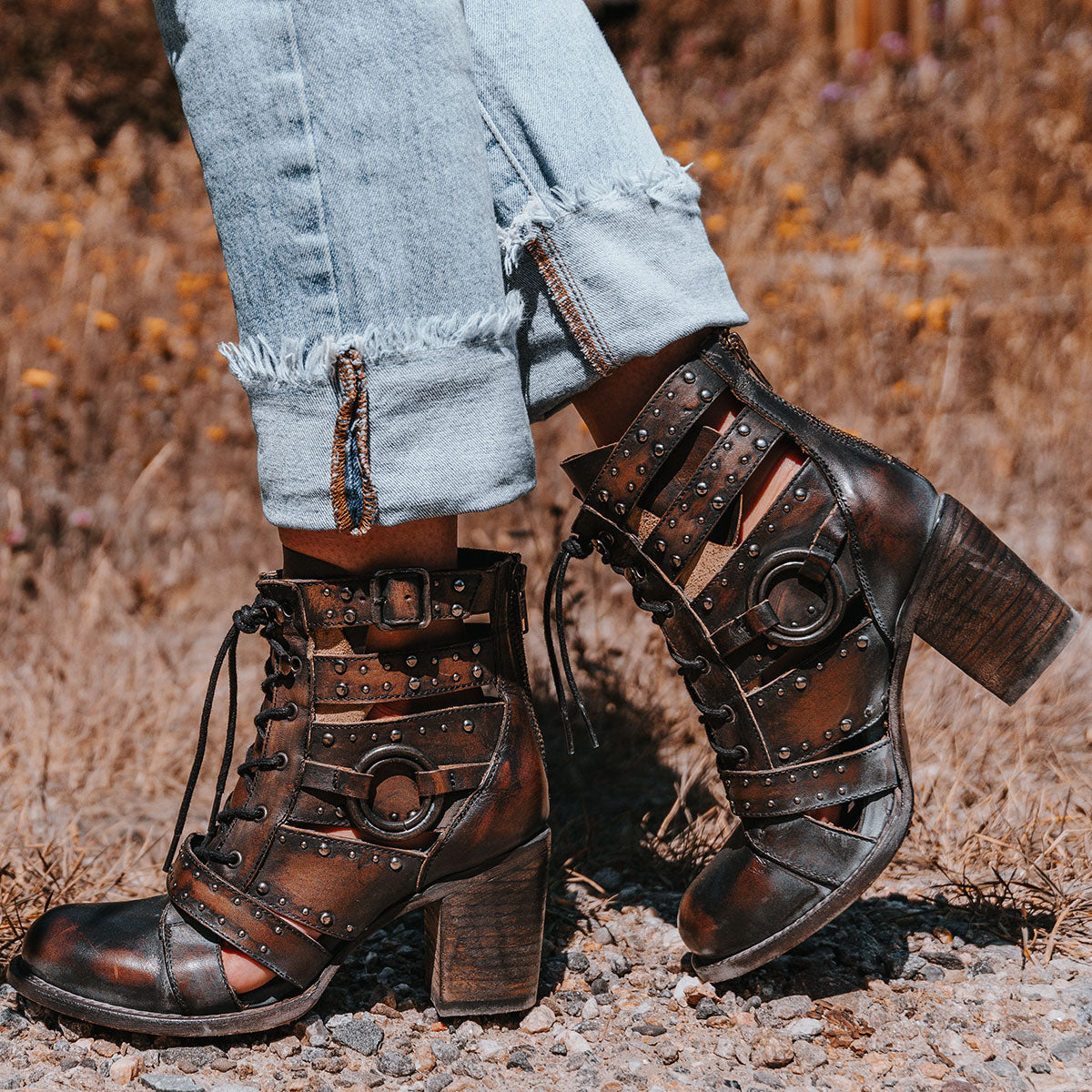 FREEBIRD women's Birch black leather bootie with adjustable front tie lacing, stacked heel and round toe construction