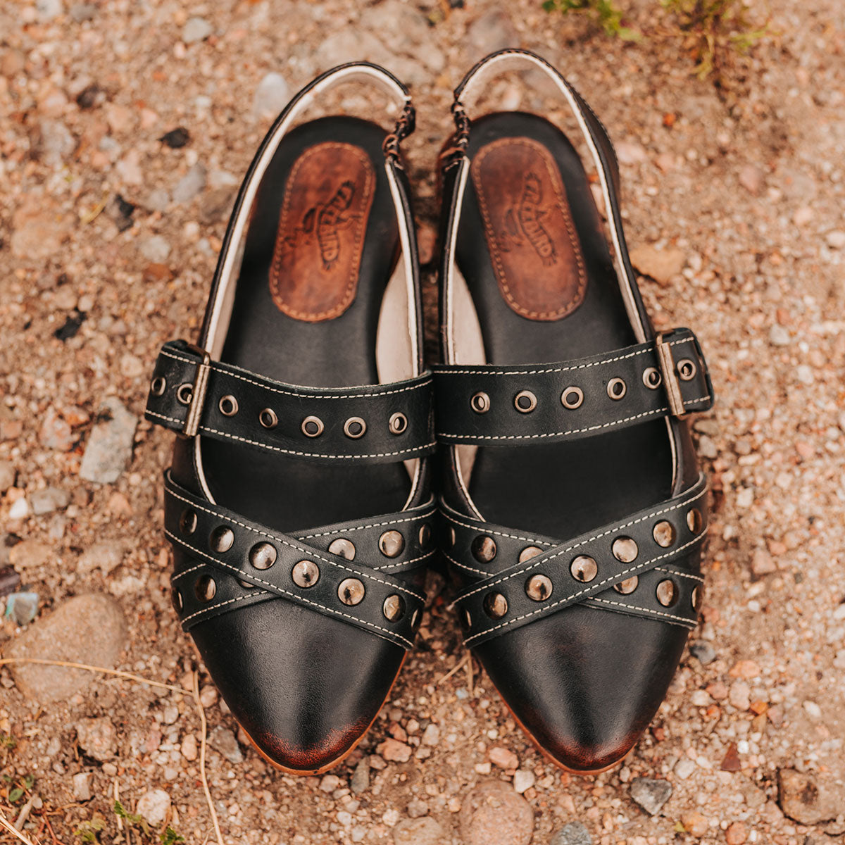 FREEBIRD women's Blair black sling back ballet flat shoe featuring adjustable buckles, low heel, and a soft pointed toe
