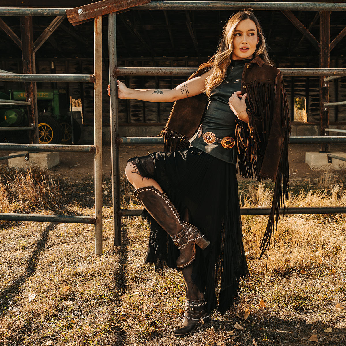 FREEBIRD women's Blakely brown heeled tall boot with shaft detailing, layered decretive ankle harnesses, and back zip closure lifestyle image