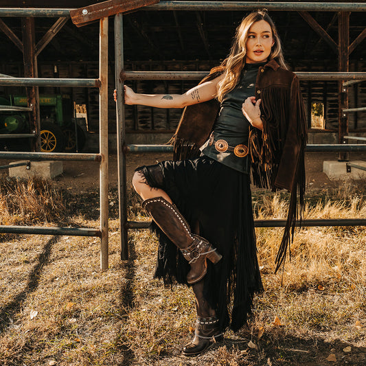 FREEBIRD women's Blakely brown heeled tall boot with shaft detailing, layered decretive ankle harnesses, and back zip closure lifestyle image