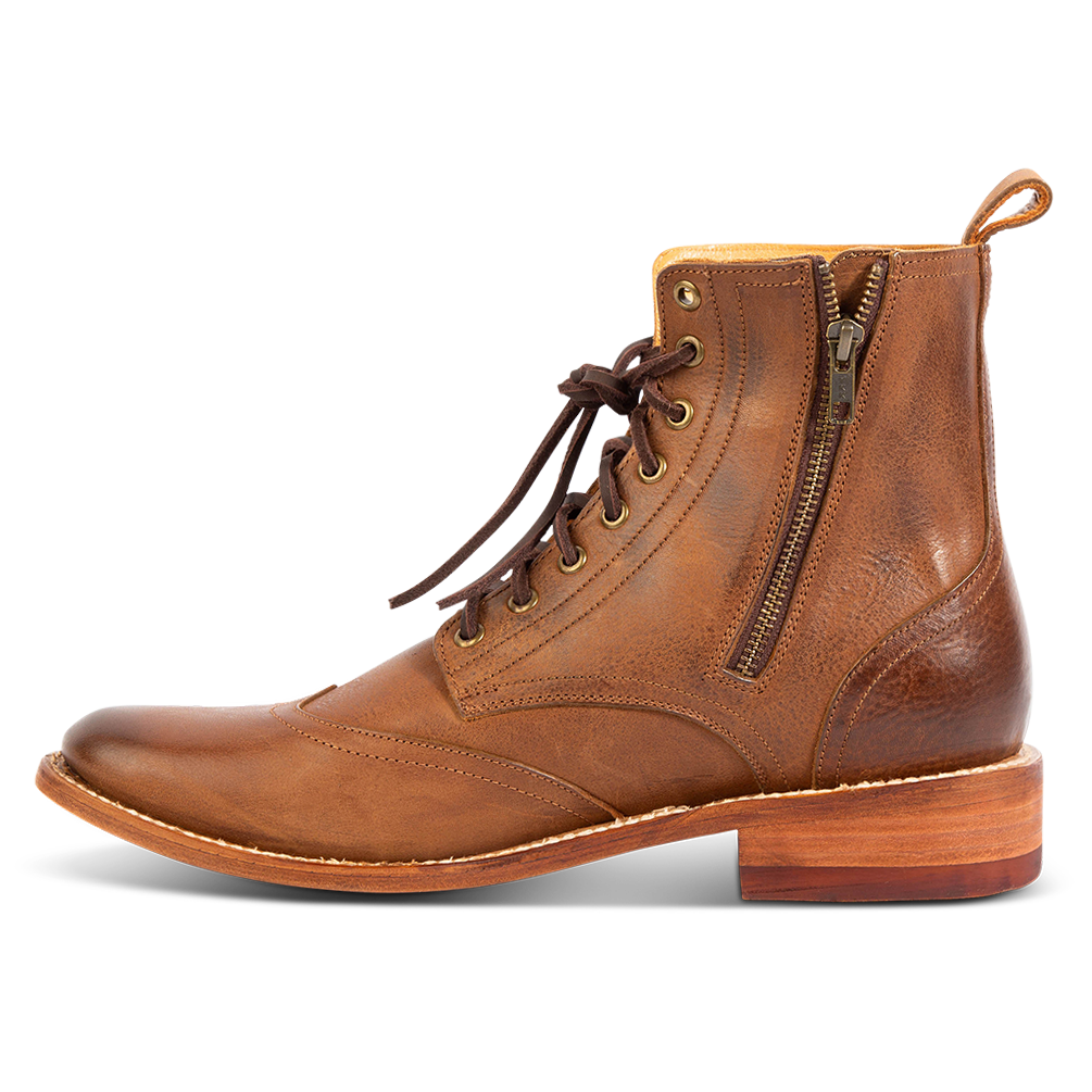 Side view showing a functional inside brass zip closure, a Goodyear welt and rear leather pull tab on FREEBIRD men's Bodie brown leather boot