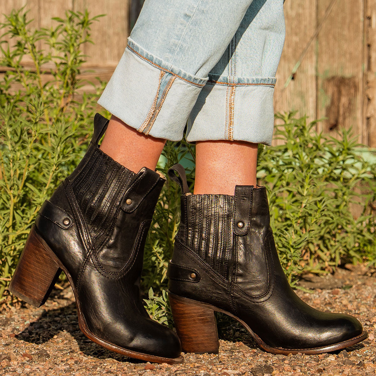 Freebird women's BOWIN black leather bootie with gore flex detailing, high heel and leather pull strap