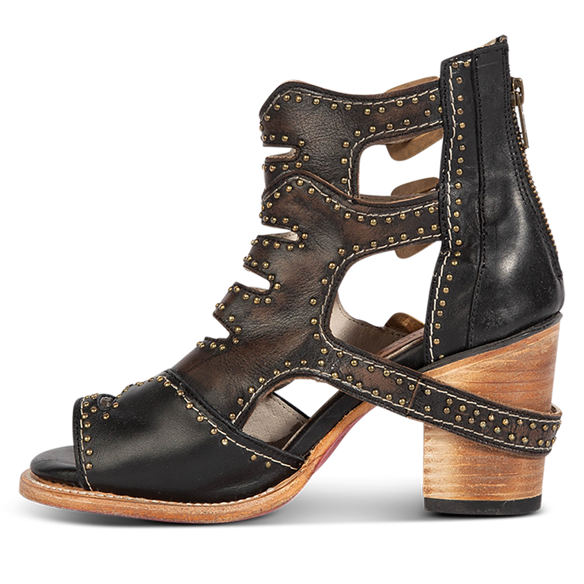 Inside view showing FREEBIRD women's Bradshaw black leather sandal with a working brass zipper, stud embellishments and cut out detailing. Finished on a lifted high heel. 