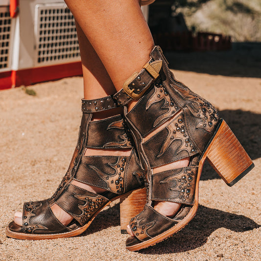 FREEBIRD women's Brooke black leather sandal with an adjustable leather ankle strap, flame leather overlays and an open toe silhouette