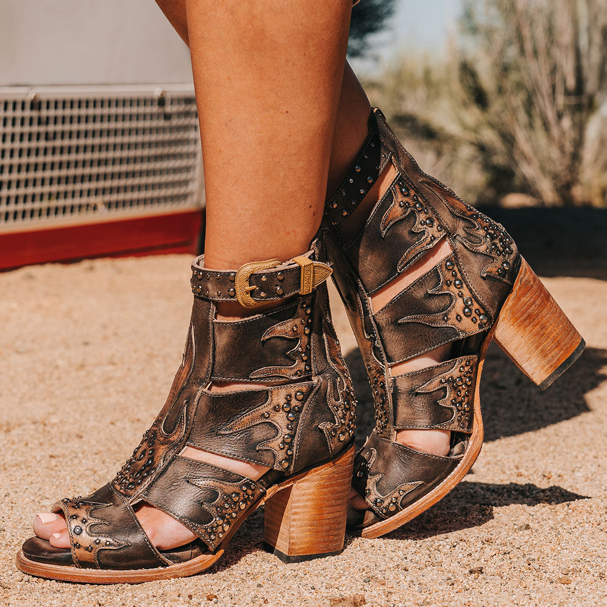 FREEBIRD women's Brooke black leather sandal with an adjustable leather ankle strap, flame leather overlays and an open toe silhouette