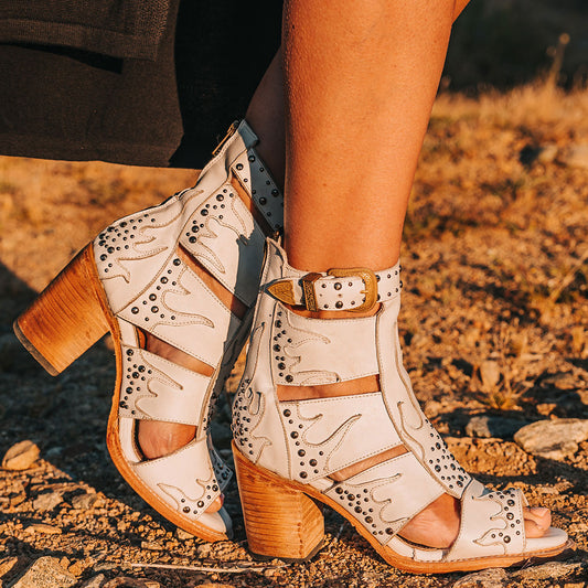 FREEBIRD women's Brooke white leather sandal with an adjustable leather ankle strap, flame leather overlays and an open toe silhouette