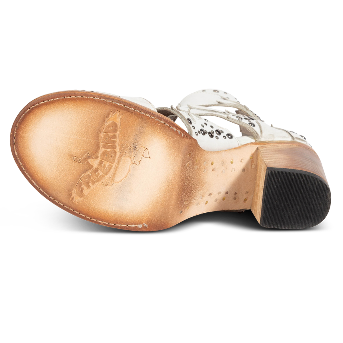 Leather sole imprinted with FREEBIRD on women's Brooke white leather sandal