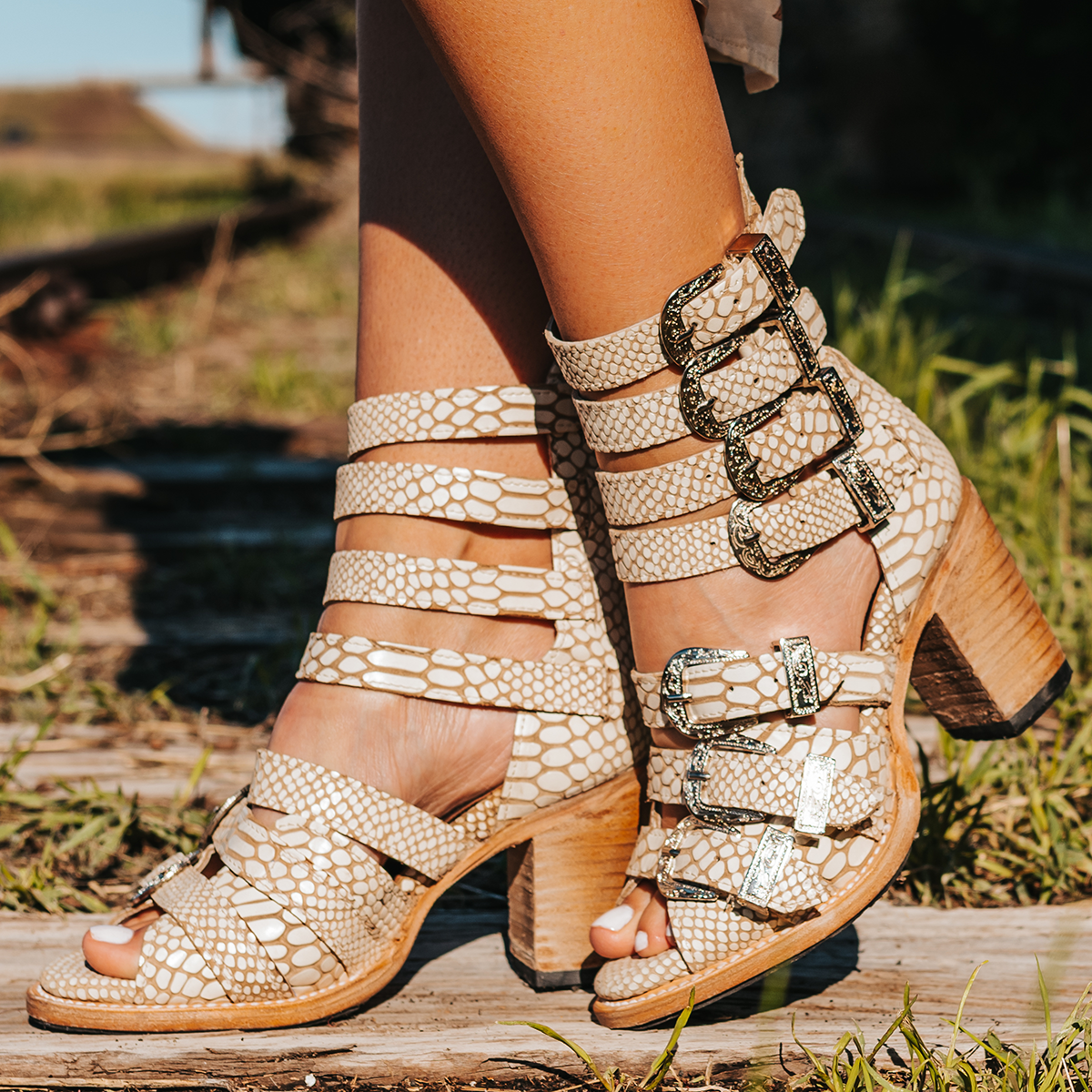 FREEBIRD women's Brooklynn white snake sandal with straps, metal western buckles and high-heel