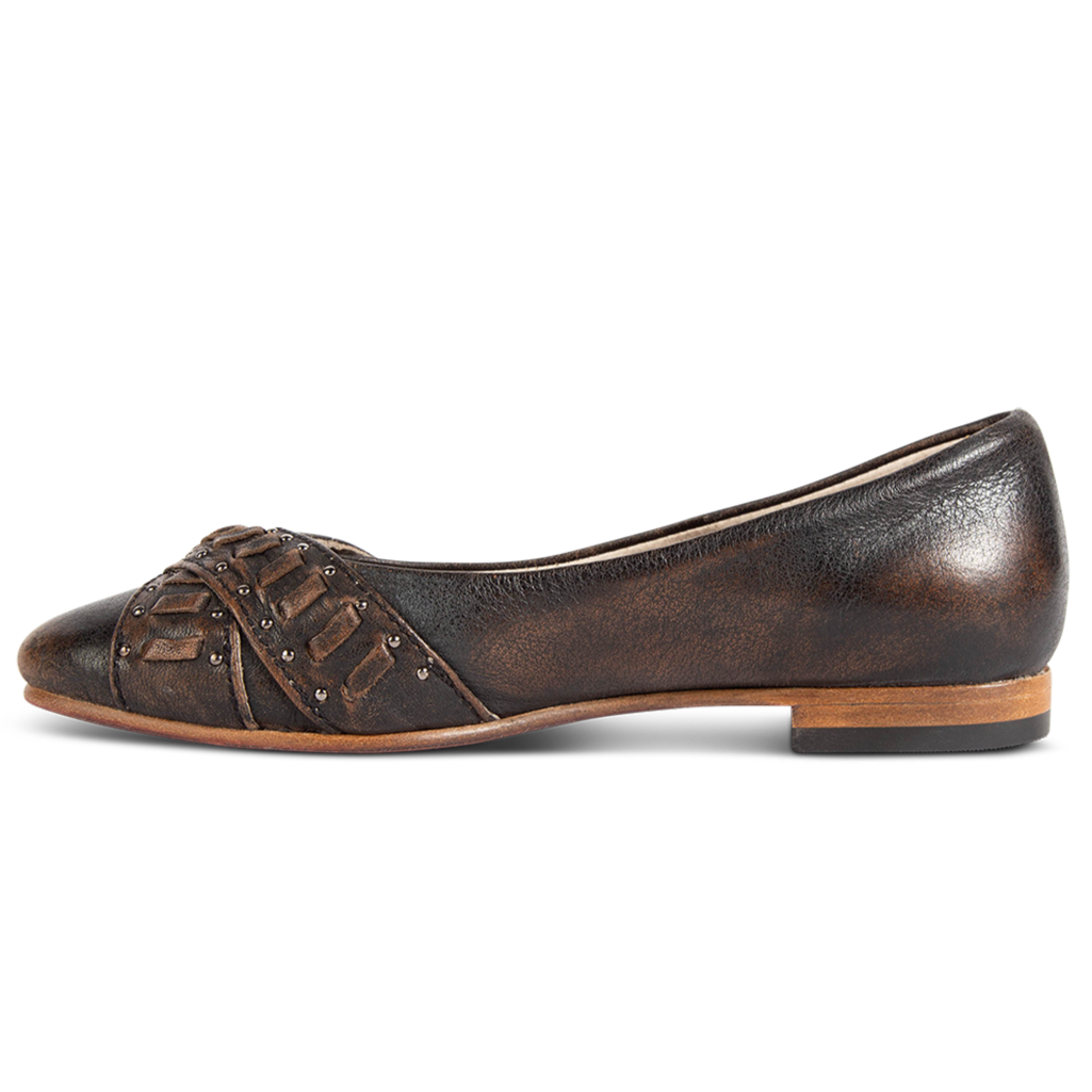 Inside view showing low heel on FREEBIRD women's Brynn black ballet flat slip-on shoe featuring stud detailing a pointed toe