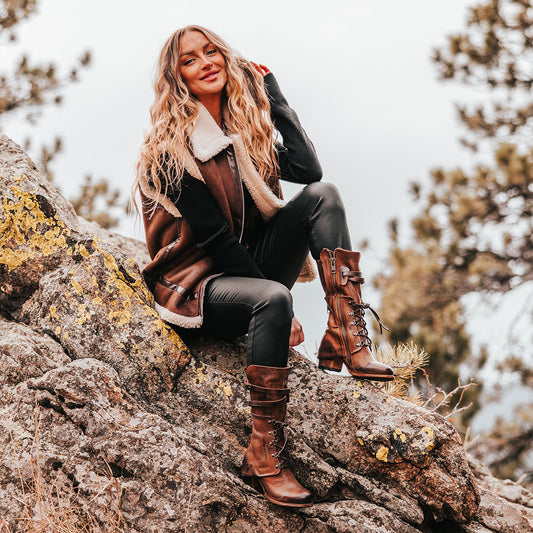 FREEBIRD women's Caboose tan leather boot featuring a leather shaft overlay with adjustable front lacing, zig-zag buckling and a full inside working brass zipper lifestyle 