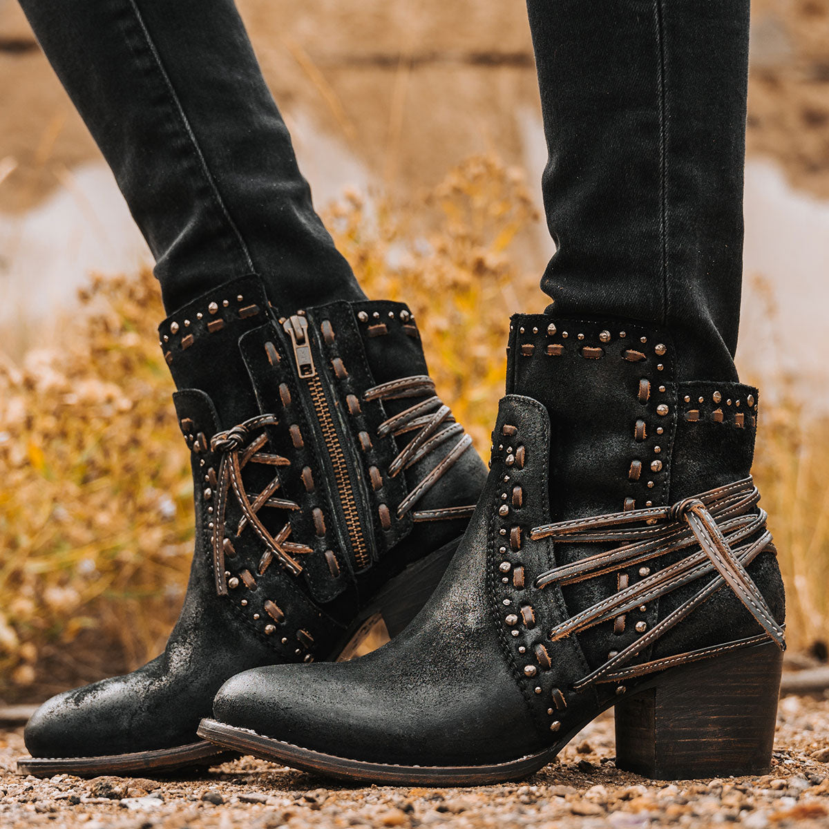 Freebird women's CAMRYN black suede leather bootie with stud embellishments, tie lacing and mid sized heel