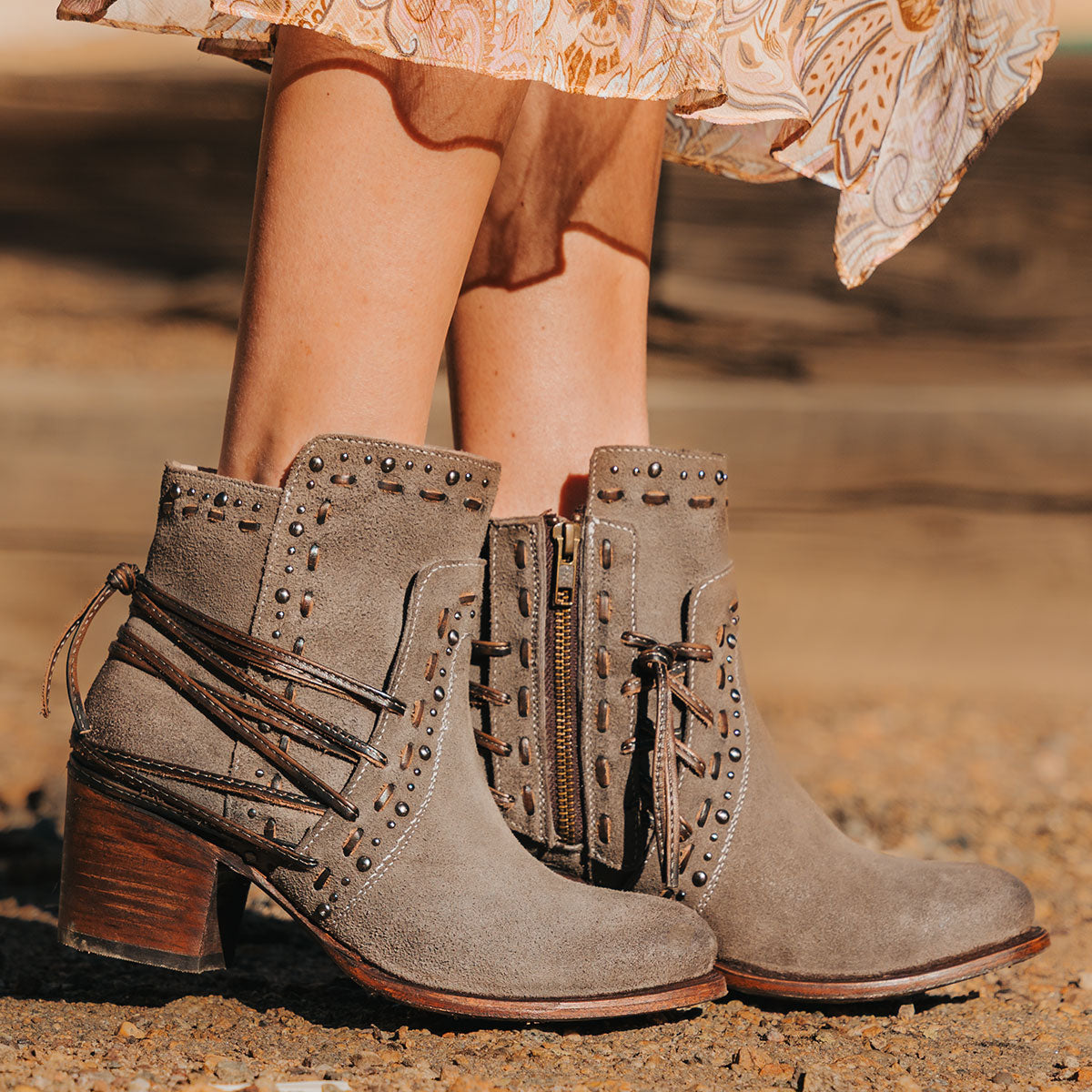 Freebird women's CAMRYN grey suede leather bootie with stud embellishments, tie lacing and mid sized heel