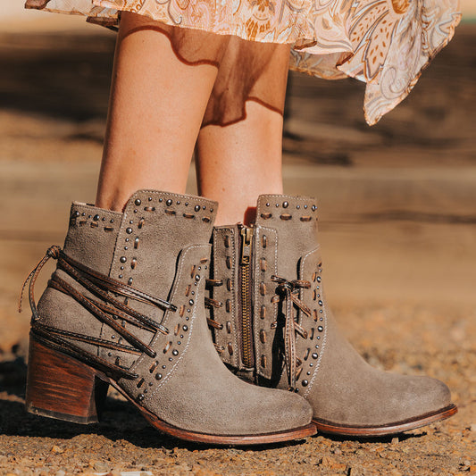 Freebird women's CAMRYN grey suede leather bootie with stud embellishments, tie lacing and mid sized heel