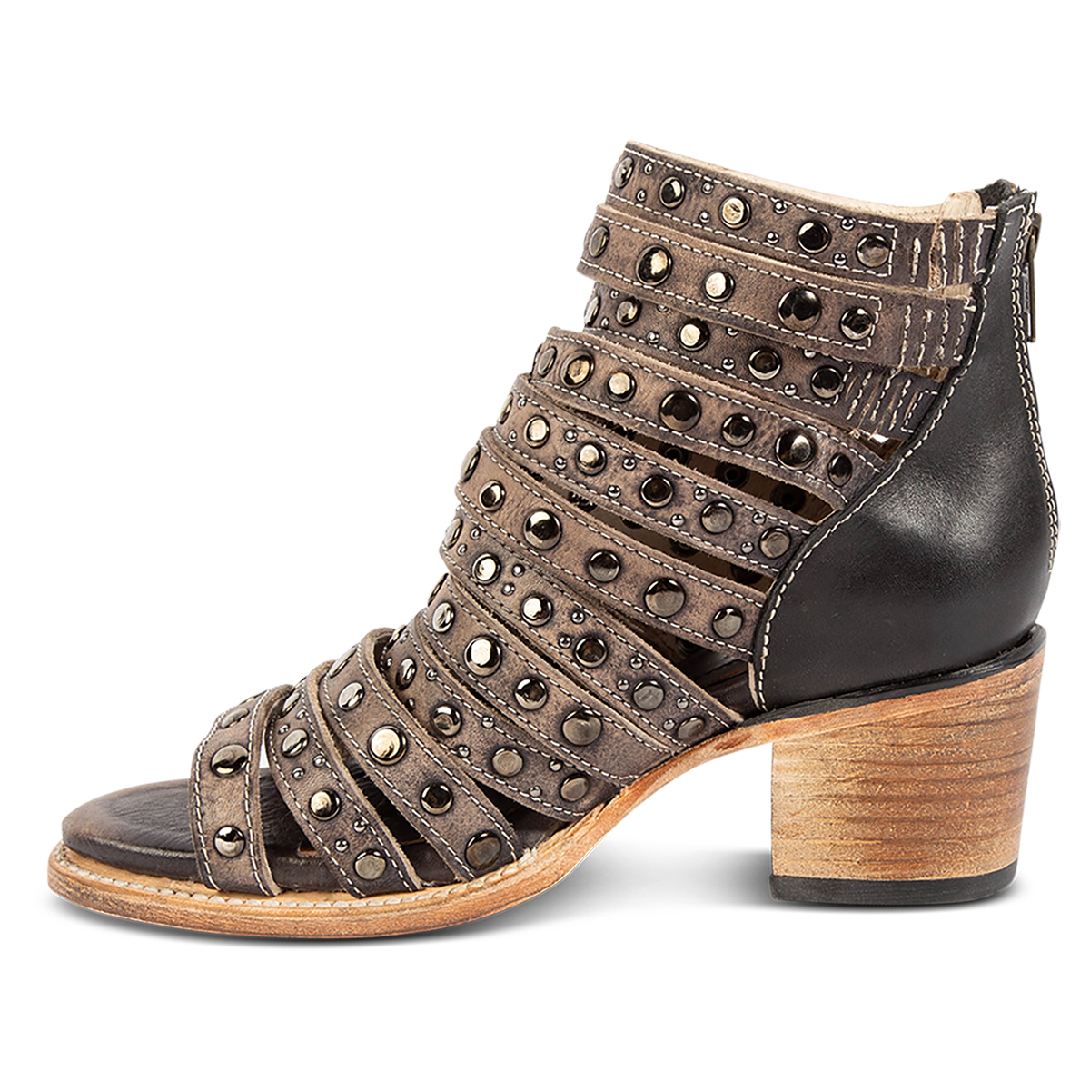 Inside view showing a stacked heel and embellished leather straps on FREEBIRD women's Cannes black distressed leather sandal
