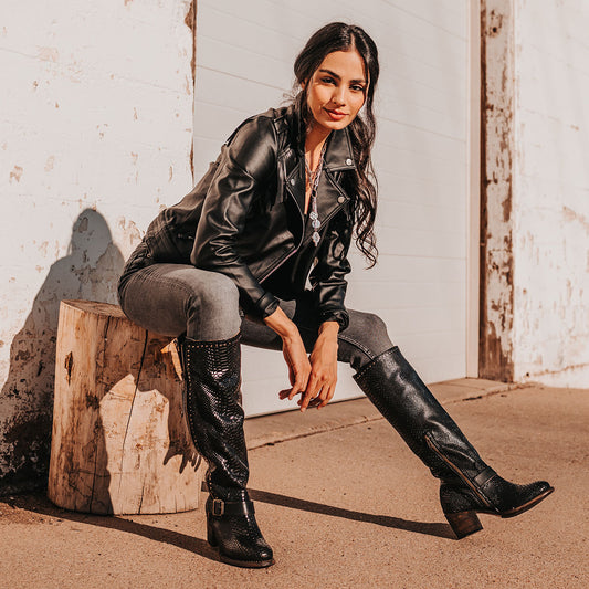 FREEBIRD women's Carson black snake tall boot with metal zipper, stud detailing and ankle strap lifestyle image