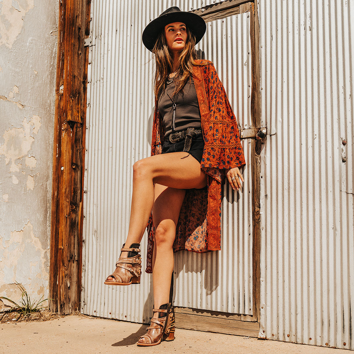 FREEBIRD women's Carterr taupe sandal with back lacing and a front dip lifestyle image
