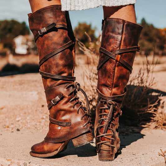 FREEBIRD women's Cassius brown distressed strappy tall boot with back lacing ankle overlay