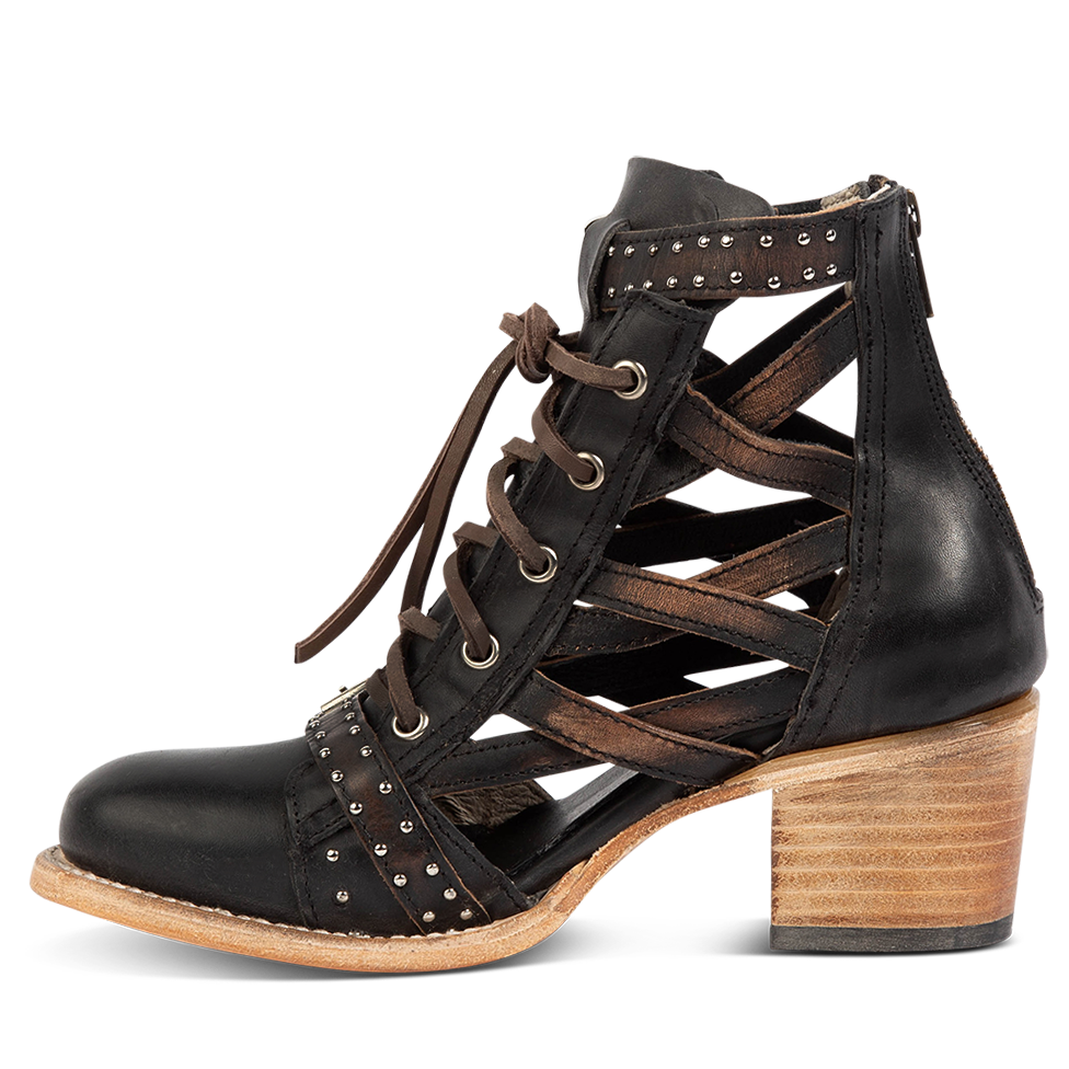 Inside view showing laser cut criss-cross leather sides on FREEBIRD women's Cheyenne black multi leather bootie