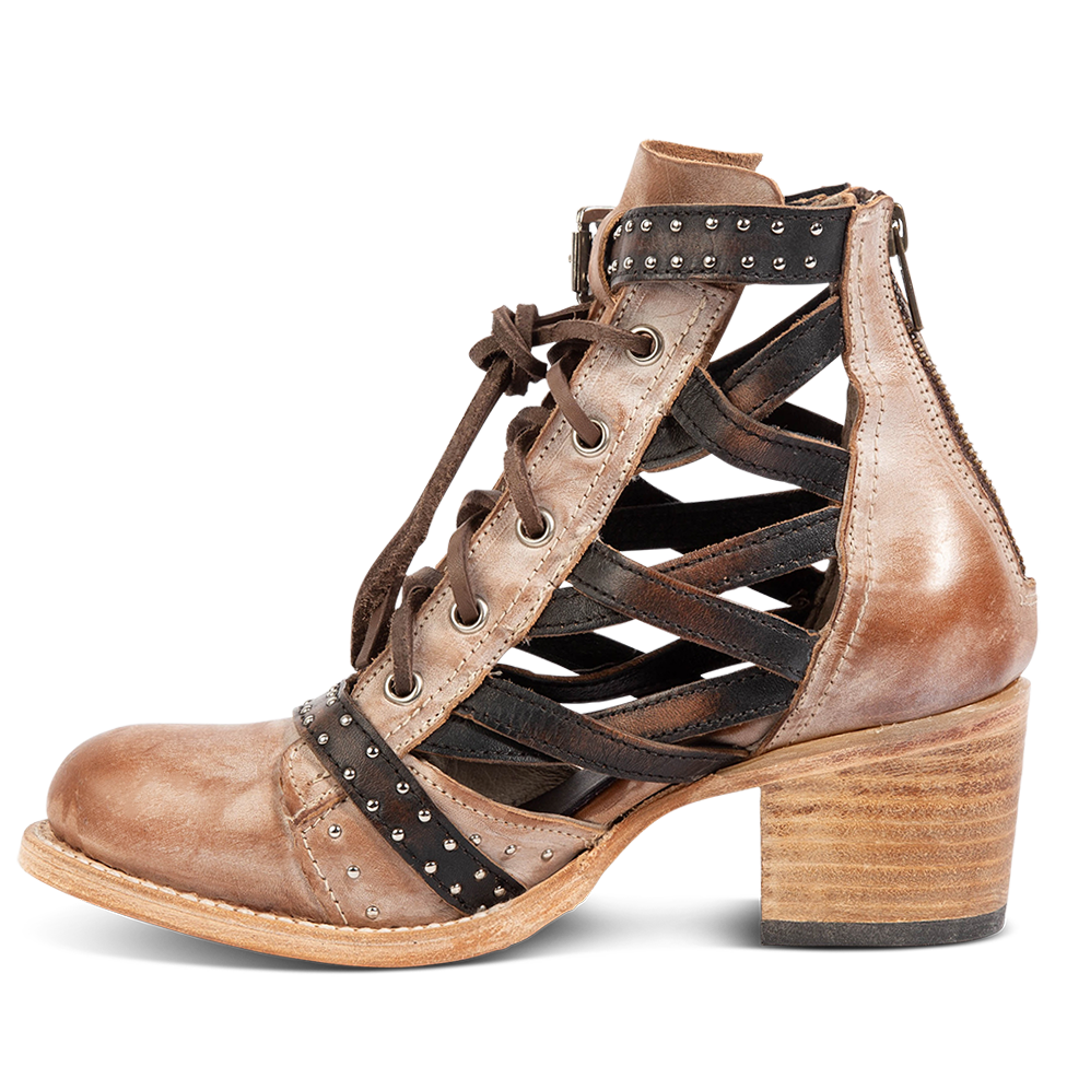 Inside view showing laser cut criss-cross leather sides on FREEBIRD women's Cheyenne taupe multi leather bootie