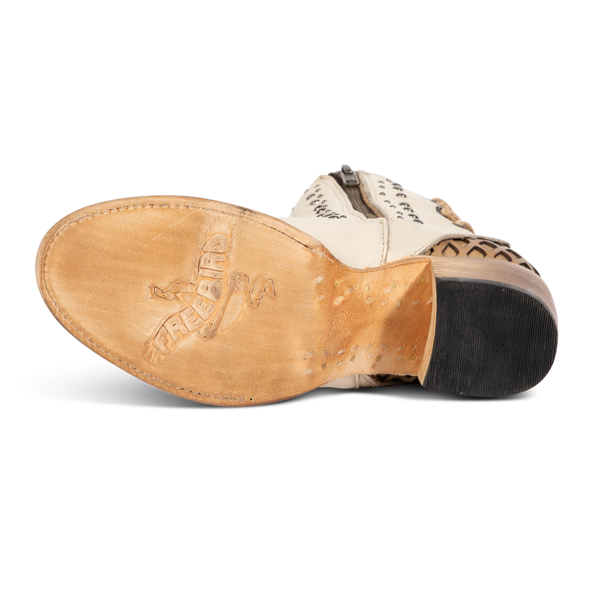 Leather sole imprinted with FREEBIRD on women's Columbia white leather bootie