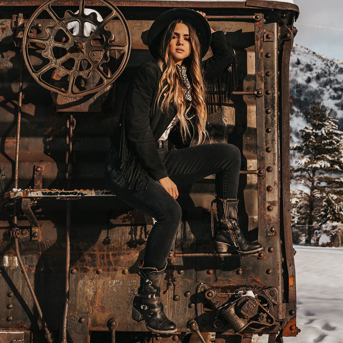 FREEBIRD women’s Cora black slouchy back lacing leather boot with adjustable straps and buckles lifestyle image