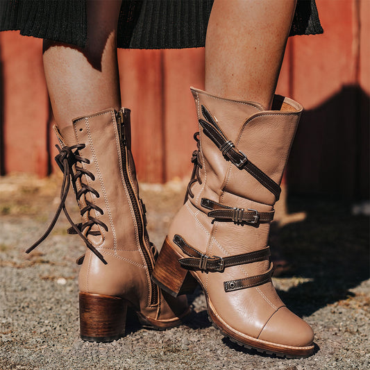 Clay CORA leather booties featuring a back-lacing design, slouchy silhouette, and adjustable silver buckle straps.