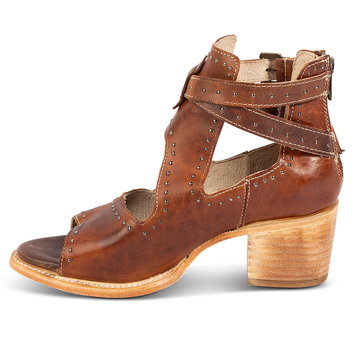 Inside view showing a block heel, dual adjustable straps and stud embellishments on FREEBIRD women's Cosmic cognac leather sandal